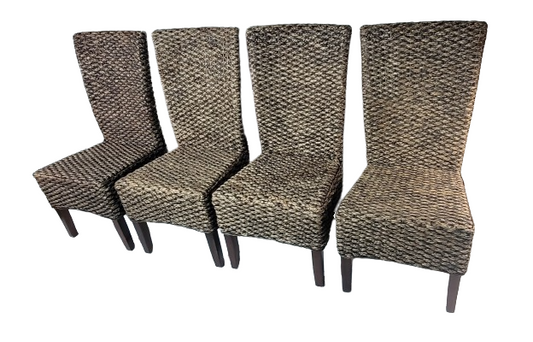 set of 4 banana leaf chairs in a row